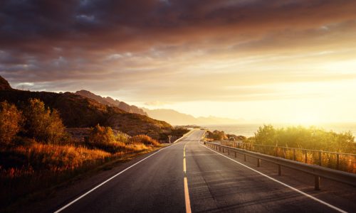 road by the sea in sunrise time,  Lofoten island, Norway